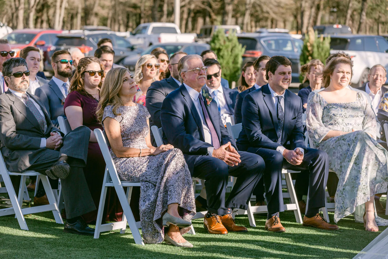 Exterior ceremony-area angle where background direction affects what appears behind the subject.