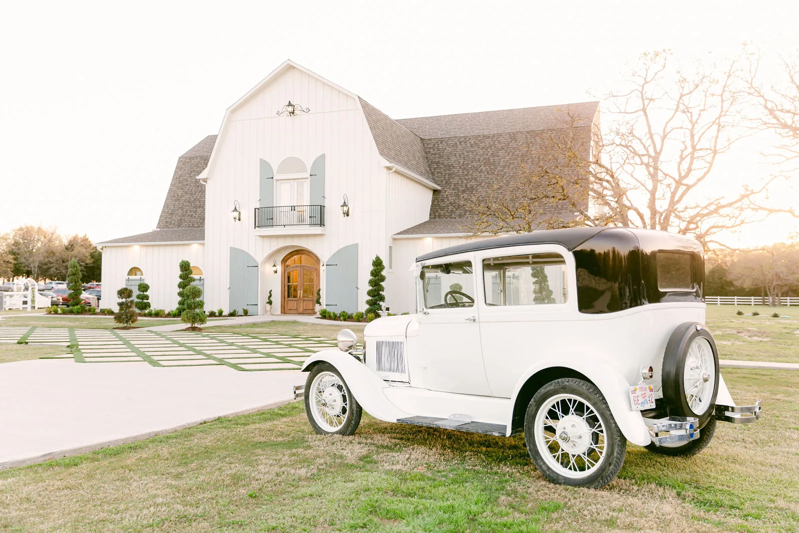 The French Farmhouse main building with the vintage car outside.