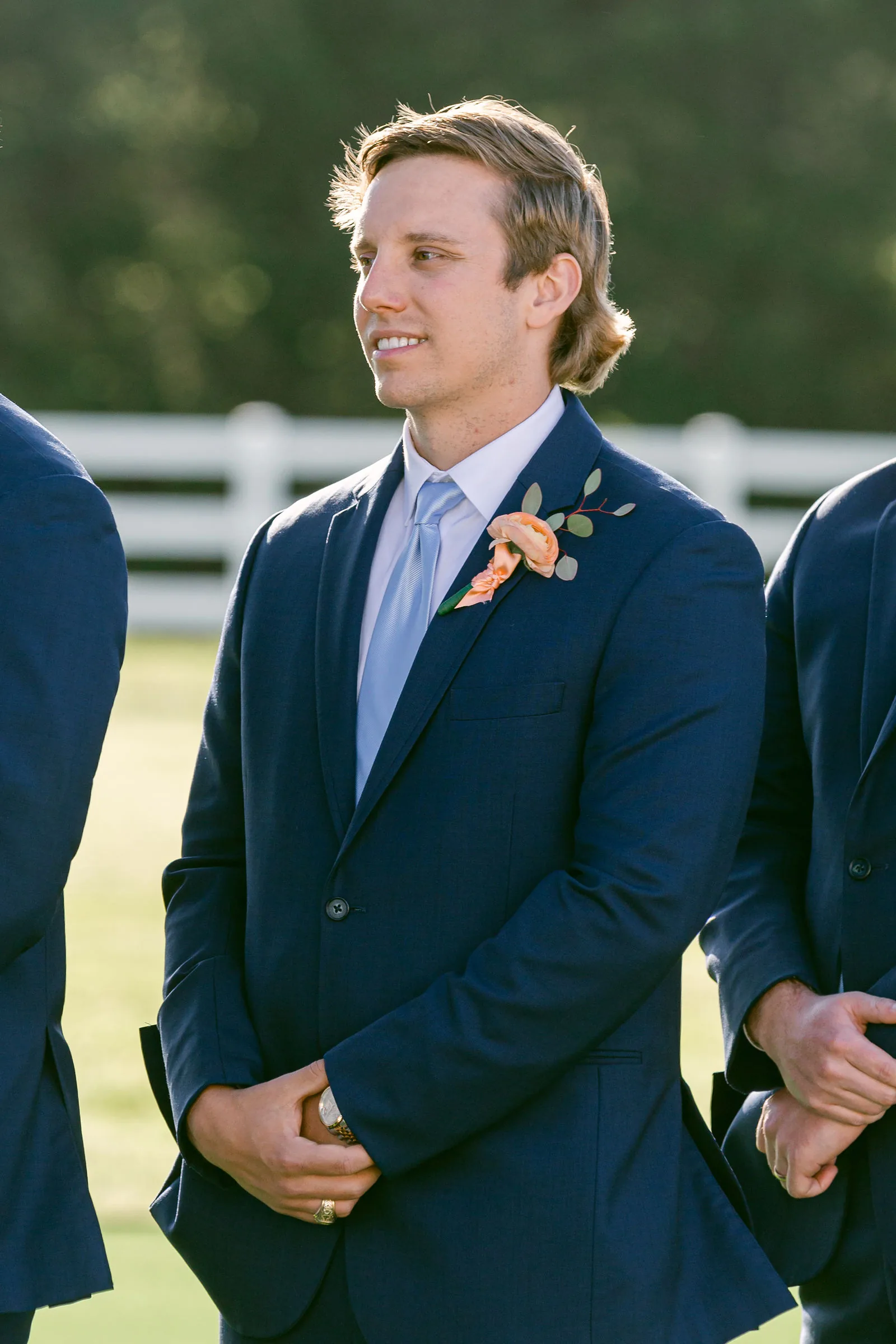 Outdoor ceremony guest reaction with flattering light and expression.